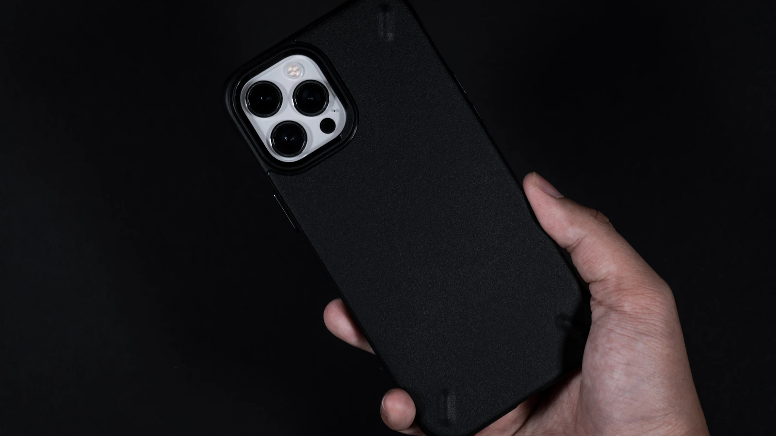 A hand holding a smartphone